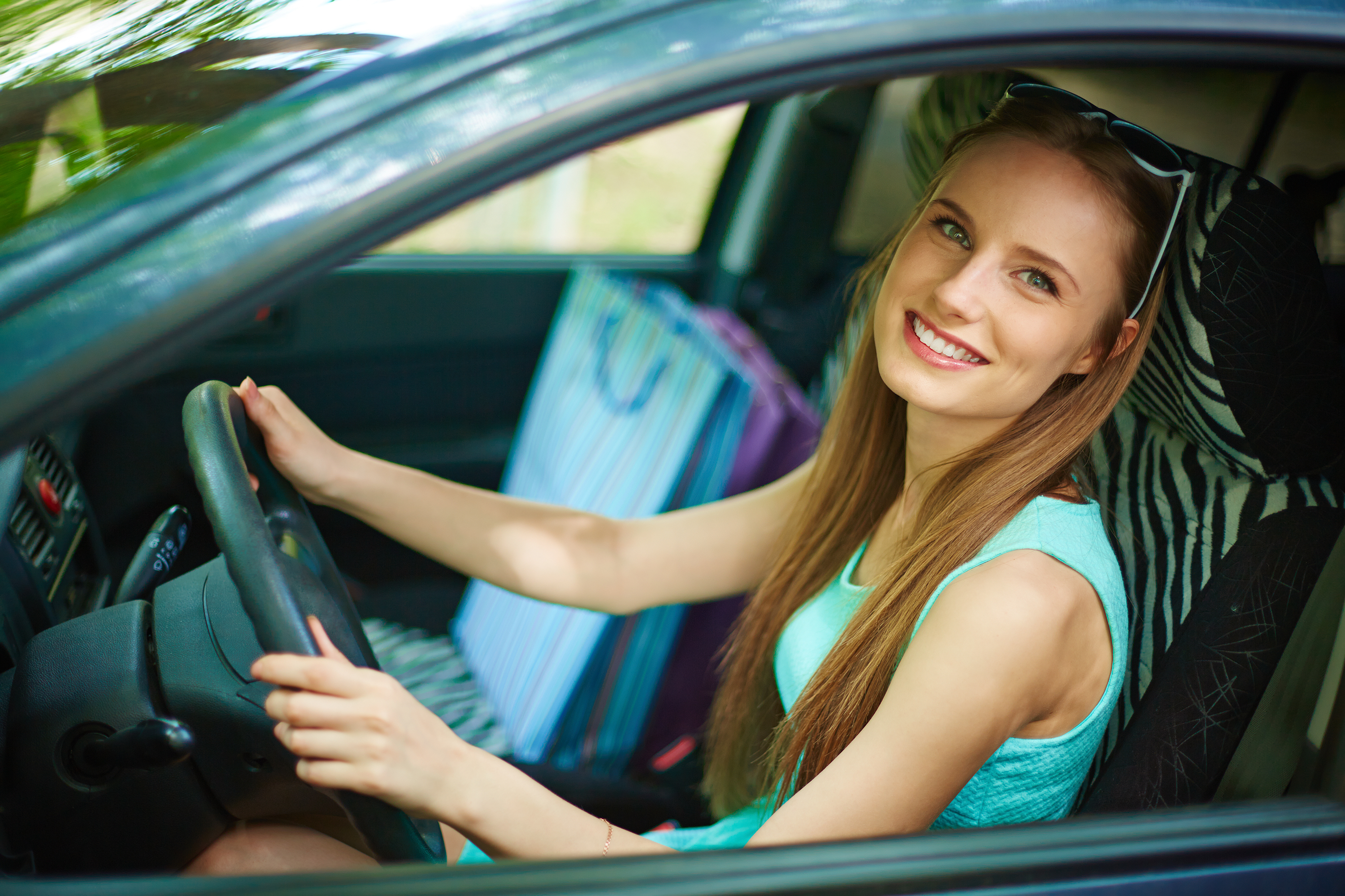 Photo Of Happy Woman Looking At Camera From Car Window
